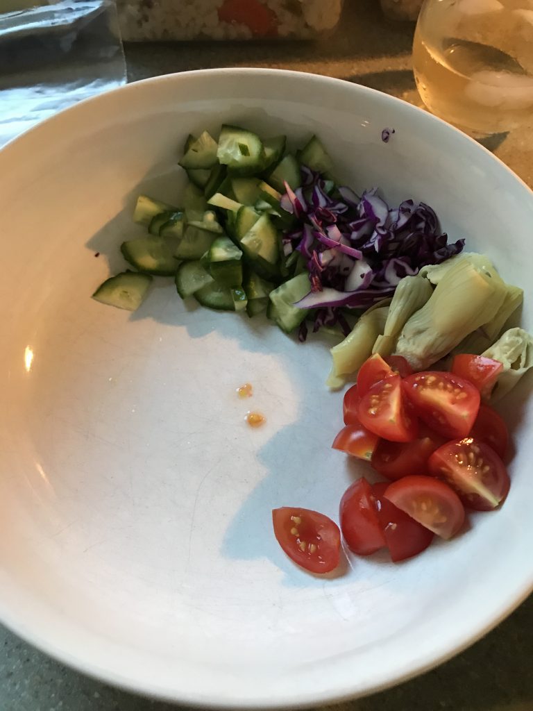 Cucumbers, red cabbage, artichoke hearts, cherry tomatoes