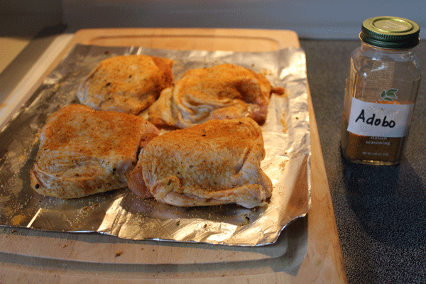 prepping chicken with adobo